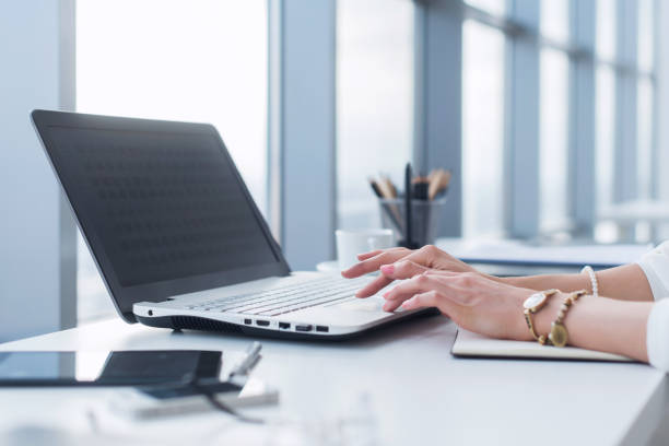 istock Female worker using laptop in office, working with new project. Woman blogging at home as a freelancer. 953202082