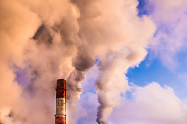 istock Pipe thermal power plant with white smoke 953205892