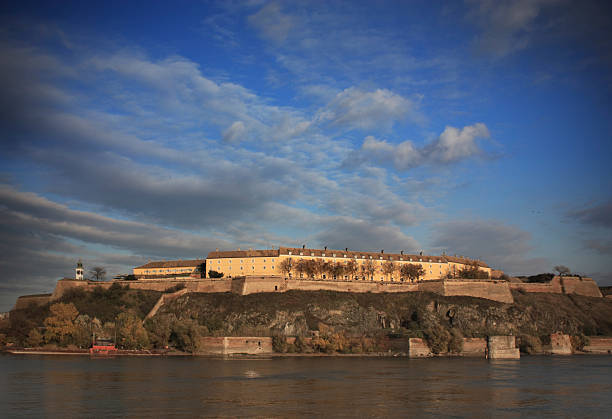 Petrovaradin town in Serbia, view of the old town and church at sunset in autumn. Travel to the Balkan countries