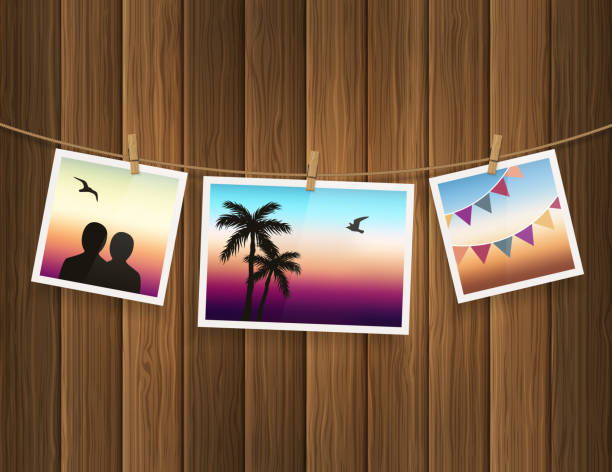 Photo frames fixed on the rope with clothespins on wood background. Vector. vector art illustration