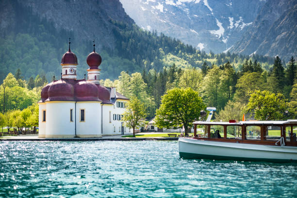 Koenigssee, Bavaria, Germany. The church of St. Bartholomae on a peninsula in the middle of the Koenigssee is one of the landmarks and excursion destinations of Berchtesgaden. The view of St. Bartholomae with Koenigssee and Watzmann Ostwand is world-famous.