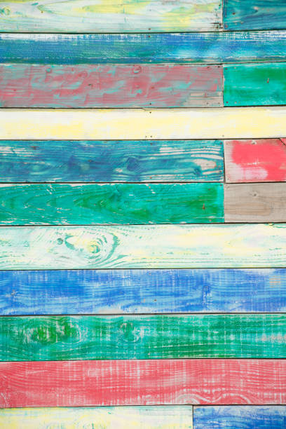 pattern wall background made with textured multicolored old weathered wood plank