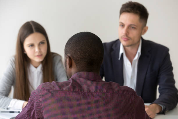 istock African applicant talking answering question at job interview, rear view 953226930