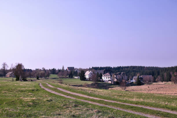istock Path leading to Reitzenhain village in spring Ore mountains in germany 953229906