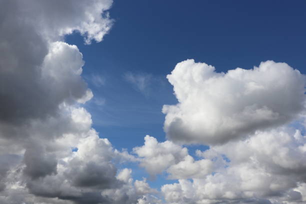 istock Close up of fluffy white clouds in blue sky 953232734