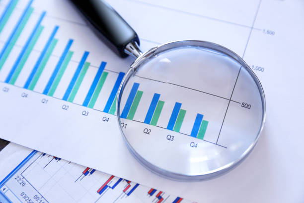 istock Magnifying Glass On Top Of Bar Chart Showing Decling Performance 953236744