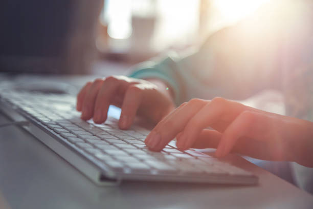 istock girl typing text on the keyboard 953243134