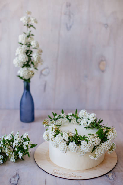 istock Vanilla cake with floral decoration. 953247776