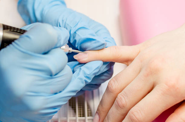 istock Manicure process, cleaning of nails by a milling cutter 953248594