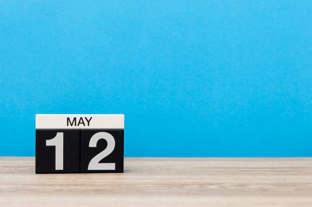 istock May 12th. Day 12 of month, calendar on blue background. Spring time, empty space for text. International Nurses Day 953251420