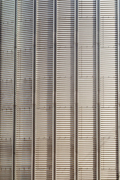 istock Texture of a surface steel structure agricultural grain dryer complex close-up. Vertical. 953264250