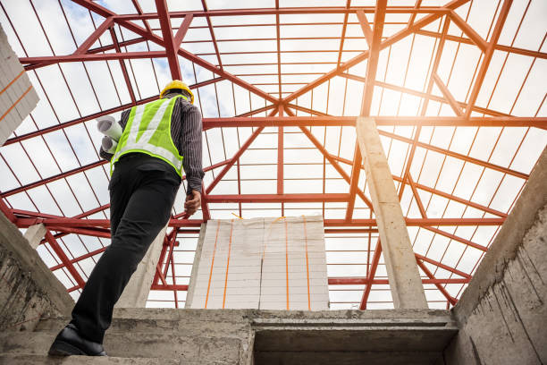 istock professional engineer worker at the house building construction site 953267488