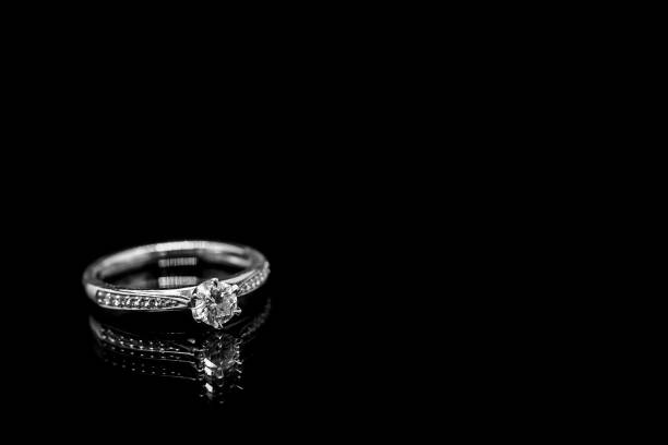 istock Close up Jewelry diamond ring on black background with reflection 953267622