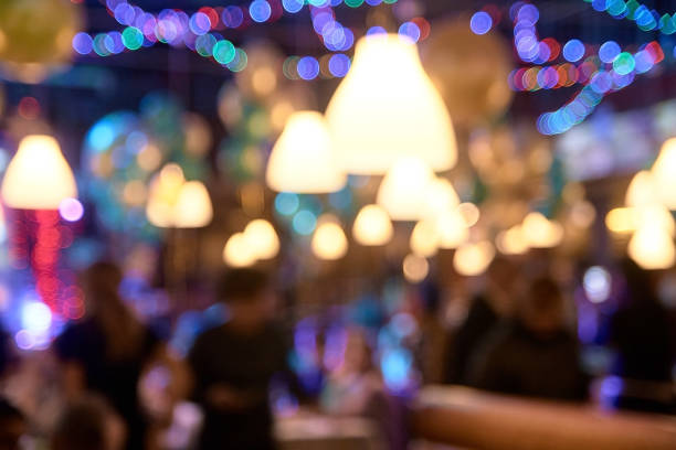 istock Celebration atmosphere. Blurred spots. People 953267754