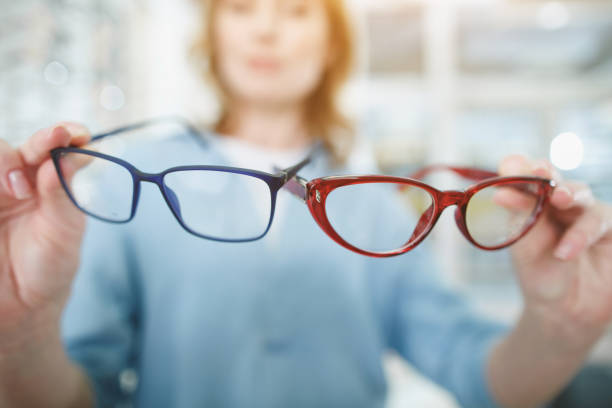 istock Woman arms keeping spectacles in optical store 953269566