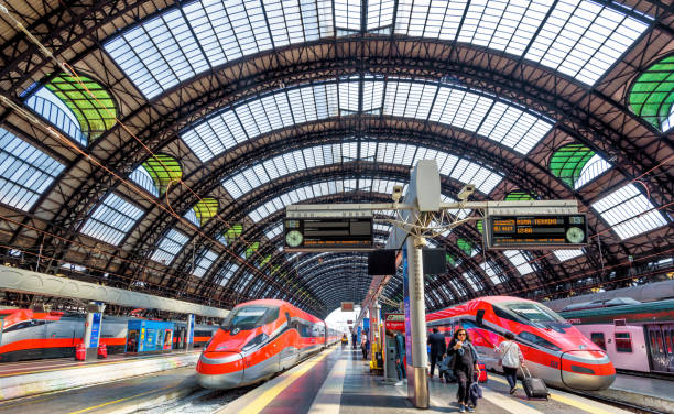 Milan, Italy  - October 12, 2025:  Tourists are waiting to board the train. The view of Milano Centrale railway station, Milan, Milan, Italy .