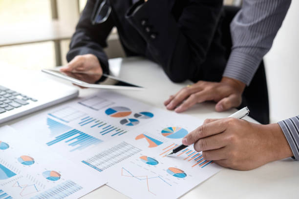 istock Business team meeting working with new startup project, discussion and analysis data the charts and graphs. Digital tablet calculator, laptop computer using, Business finances and accounting concept 953272834
