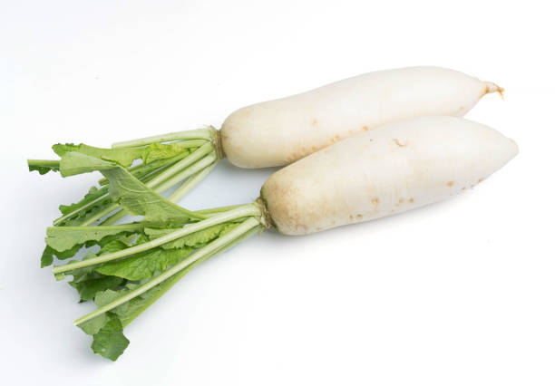istock daikon radishes isolated on white background 953272926