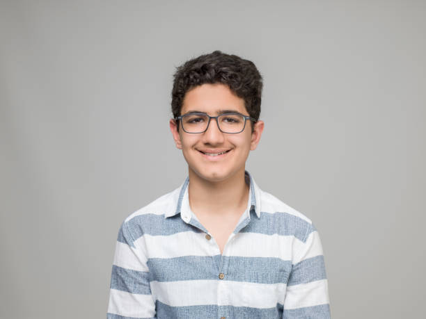 istock Teenage boy portrait, smiling 953277798