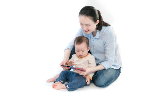 istock Mother is teaching the baby to read 953281264