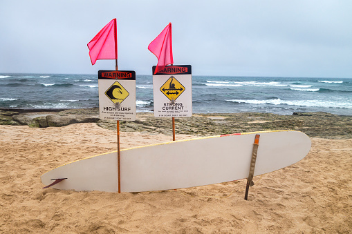 A sign informing beach goers of the dangers of the fruit