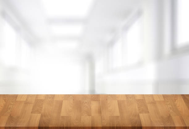 istock Wooden board empty table  window blurred background can be used for display or montage your products and Mock up 953286220