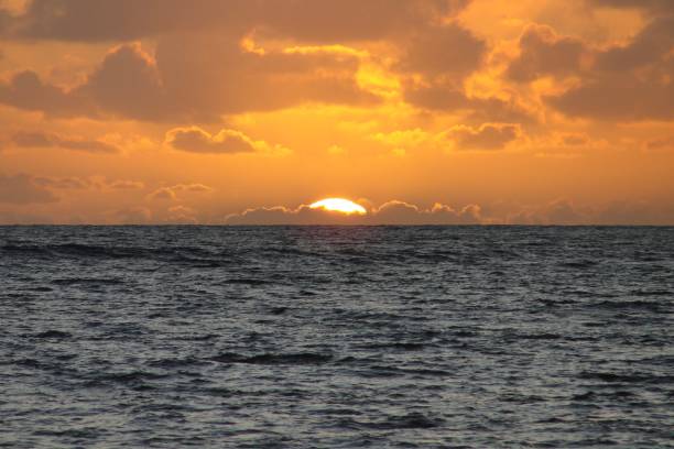 istock Kauai, Hawaii - January 09 2016: Blacksand Beach Sunset 953287638