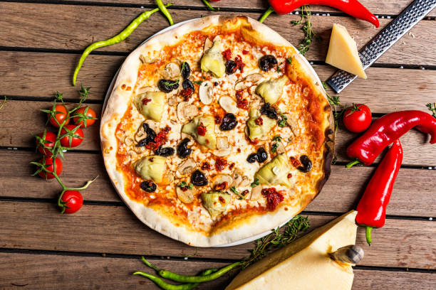 istock Pizza with artichoke, cheese and vegetable 953287904