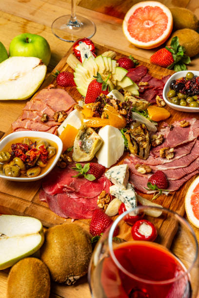 istock Cold meat appetizers with fruits, cheese and wine 953290374