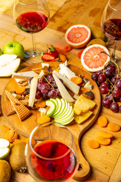 istock Cheese board with fruits and wine 953290730