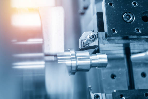 istock The CNC turning or lathe machine cutting the thread 953294588