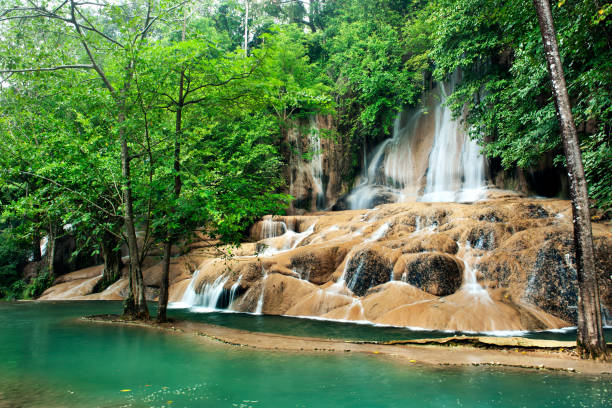 istock waterfall in thai national park. In the deep forest on mountain. 953294878