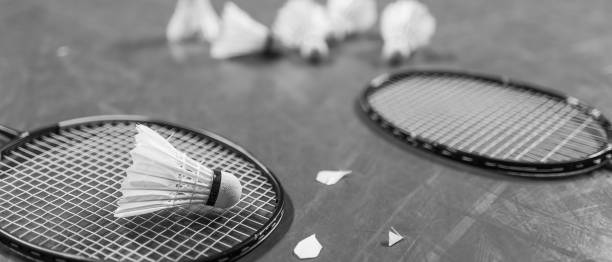 istock Badminton ball (shuttlecock) and racket on court floor 953295310