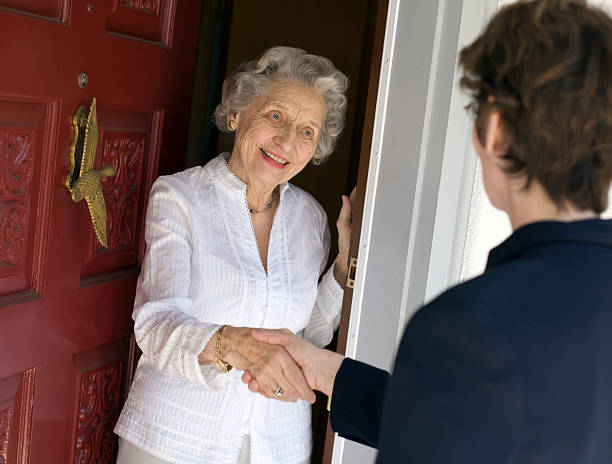 Senior woman friendly handshake stock photo