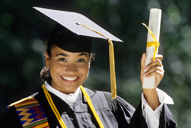 Young woman graduating stock photo