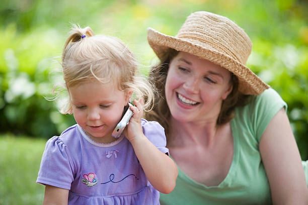 istock Mother and daughter in garden 95340057