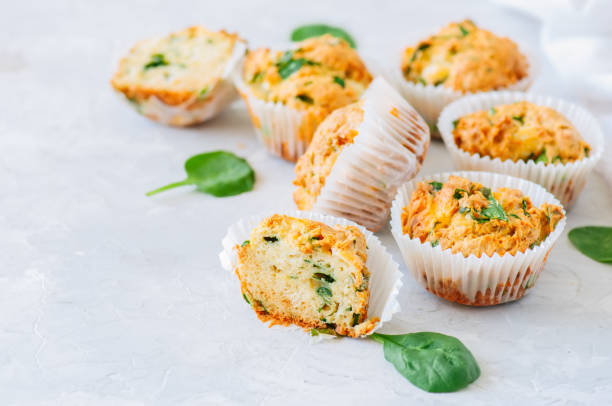 istock Savory potato spinach and feta muffins on a white stone background. Copy space. 953424470