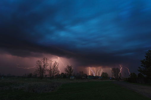 Multiple lightning strikes under dramatic cloudy sky