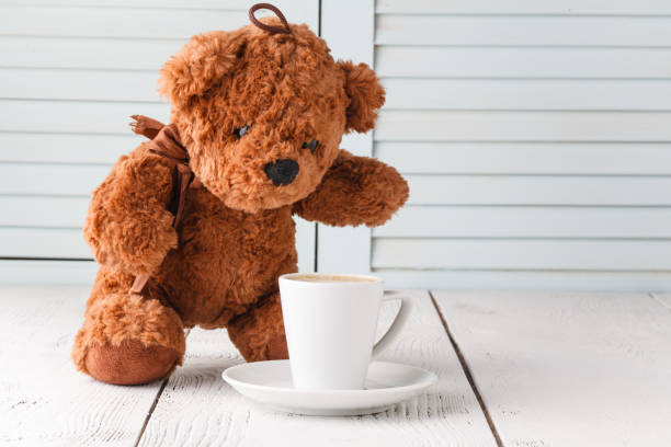 istock Teddy bear with cup of coffee 953425522