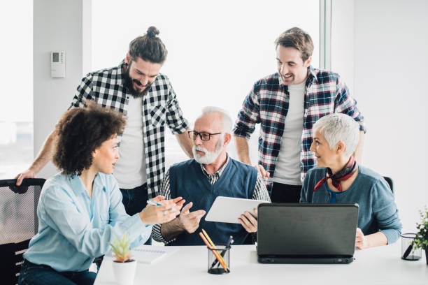 istock Multi-gender coworkers having fun at office 953427168