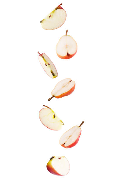 istock Falling sliced apple and pear isolated on white background with clipping path 953427438