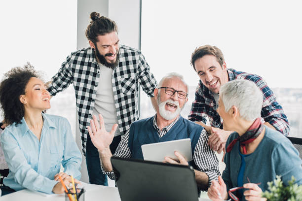 istock Coworkers laughing and having fun at office 953427524