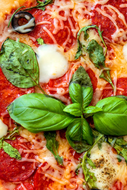 istock Pepperoni Pizza isolated on white background. Pizza with mozzarella cheese, Basil leaf  and tomato sauce, top view