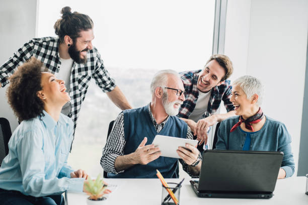 istock People laughing out loud due to relaxed day at work 953430132