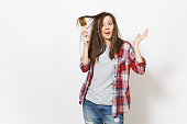 Young crazy loony woman in casual clothes painting hair with paint brush isolated on white background. Instruments, accessories for renovation apartment room. Repair home concept. Advertising area.