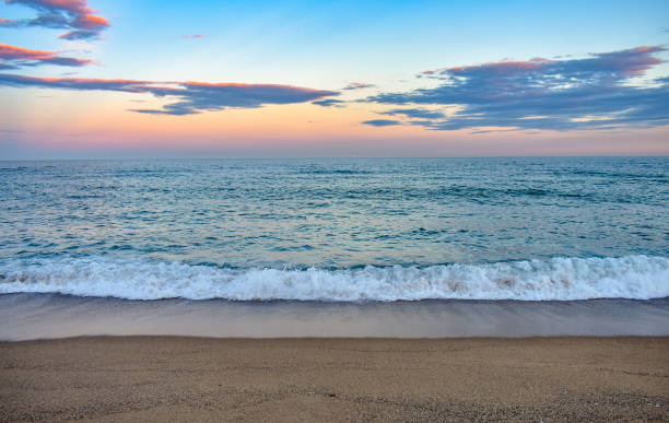 Beautiful View from Mar Bella Beach ("Platja de la Mar Bella") During Sunset, in Barcelona, Spain Beautiful view from Mar Bella Beach ("Platja de la Mar Bella") during sunset, in Barcelona, Spain barcelona beach stock pictures, royalty-free photos & images