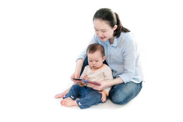 istock Mother is teaching the baby to read 953431774