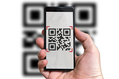 Man is scanning QR code with camera in mobile phone.
