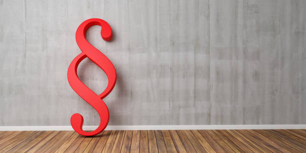 istock Red Paragraph smybol against a grey concrete wall - law and justice concept image - 3D Rendering 953436688