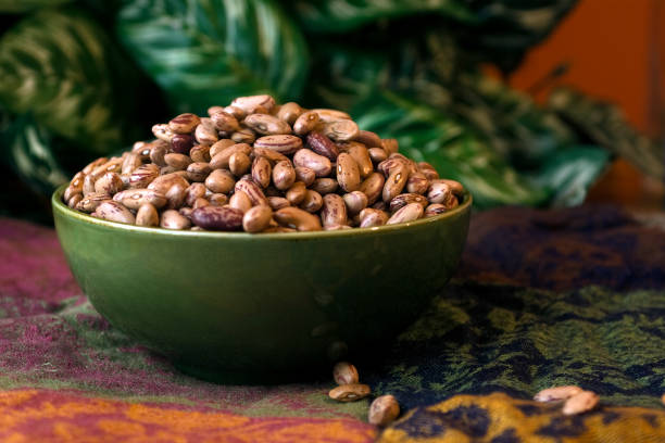 Green bowl full of dry beans